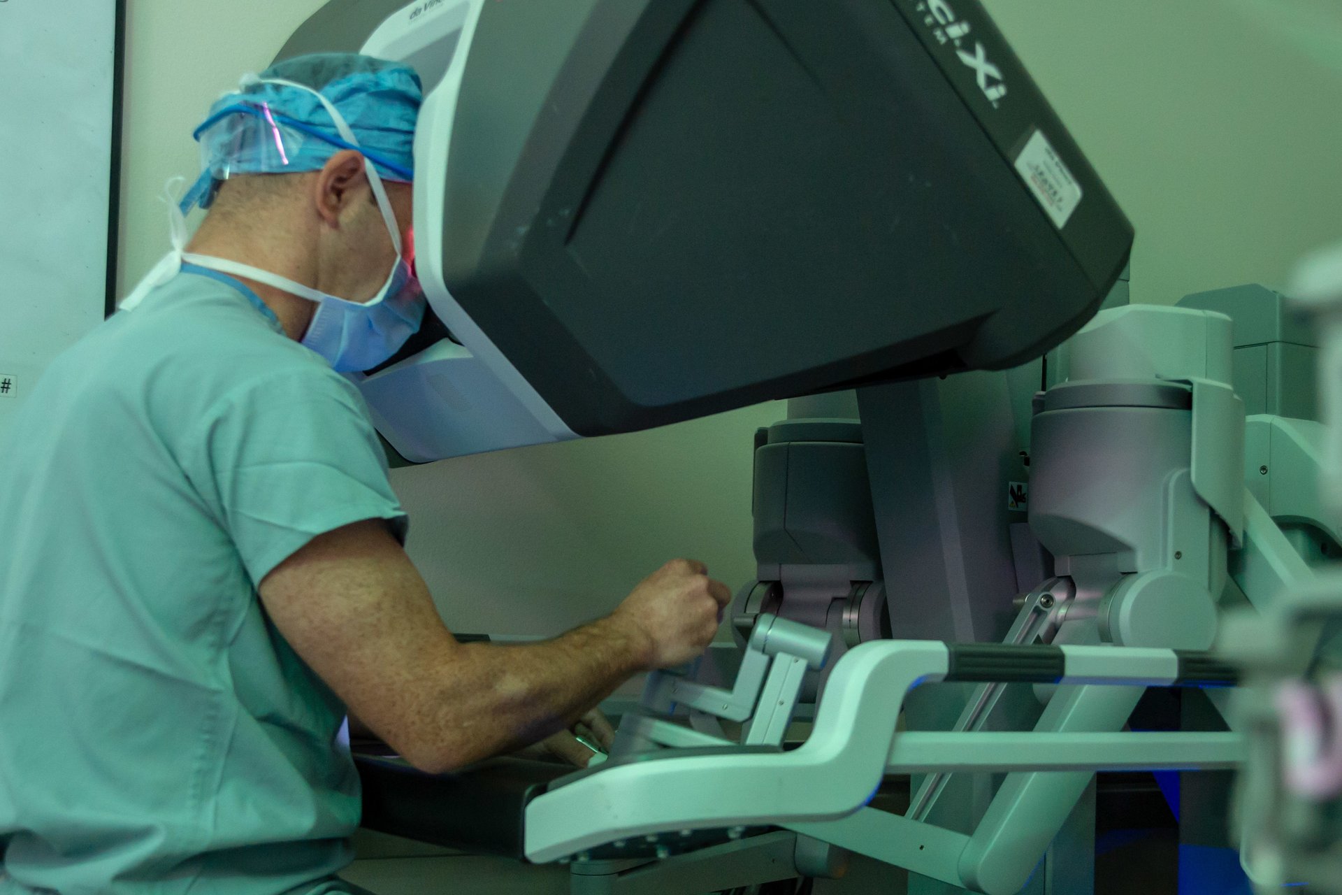 Surgeon operating a robotic surgical system
